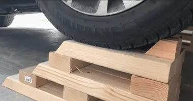 Lifting a Car By Using pieces of wood